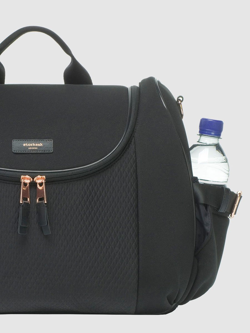 storksak poppy luxe scuba black, convertible changing bag, side view with water bottle in pocket