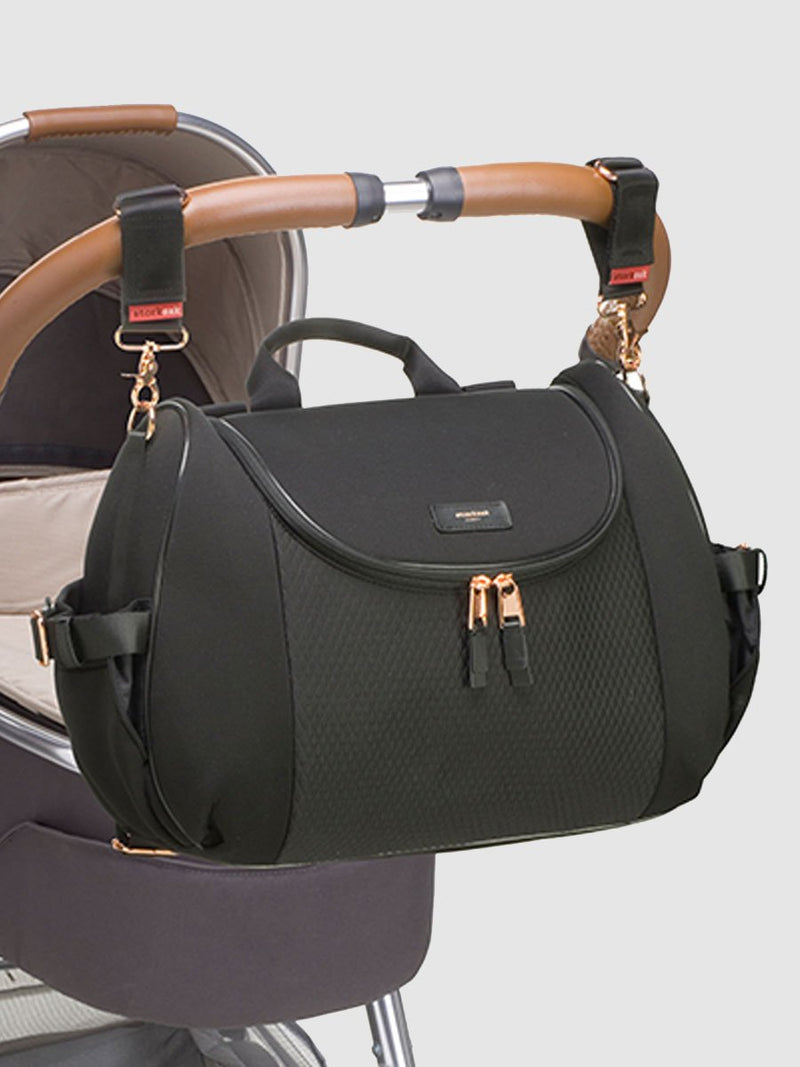 storksak poppy luxe scuba black, convertible changing bag, attached to pram with stroller clips