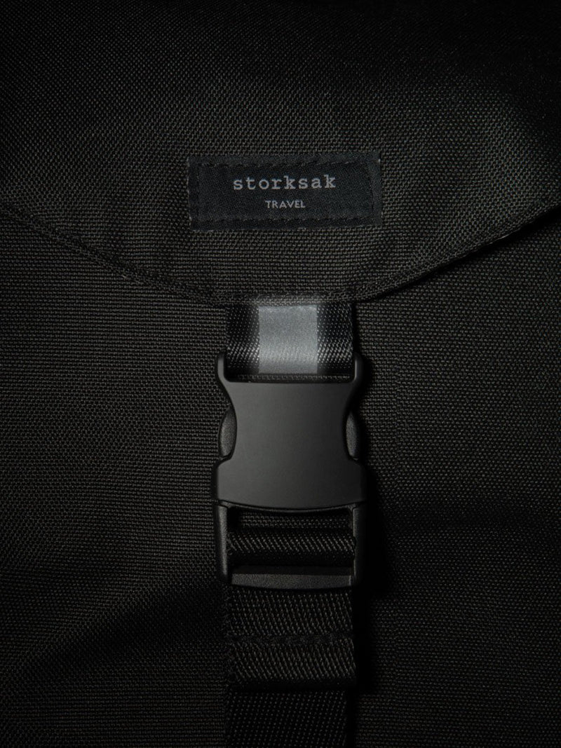 storksak travel eco backpack black, changing bag rucksack, recycled material, close up of reflective strip