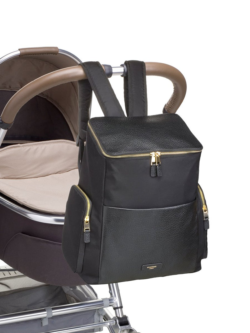 Storksak Alyssa |  Black convertible diaper changing Bag with Gold Zips | attaches to pram with clips on backpack straps