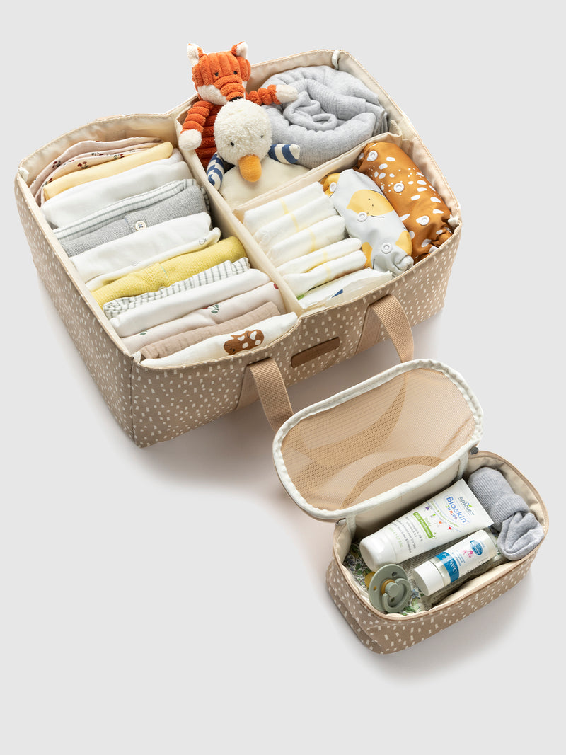 Storksak organic nappy caddy seashell | top view with baby items packed in caddy