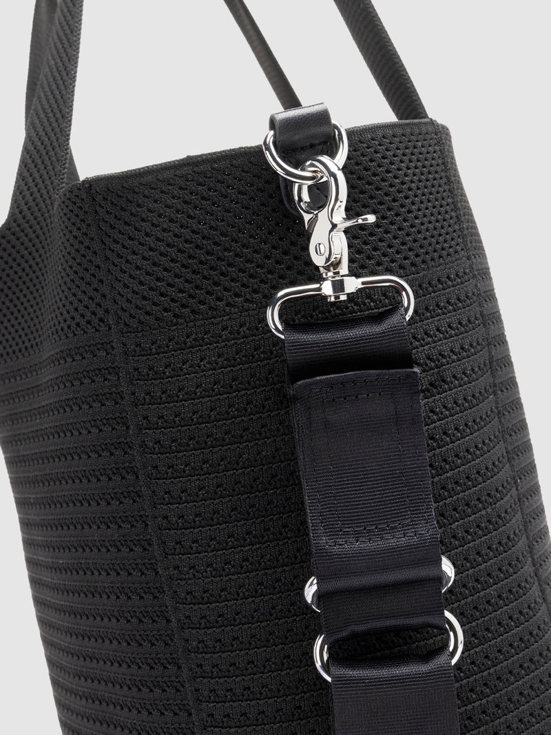 Storksak Thea Black | long strap attached to tote