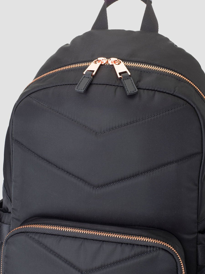 storksak hero quilt black, changing bag backpack, in quilted nylon with rose gold hardware, close up of wide opening and double zip pull