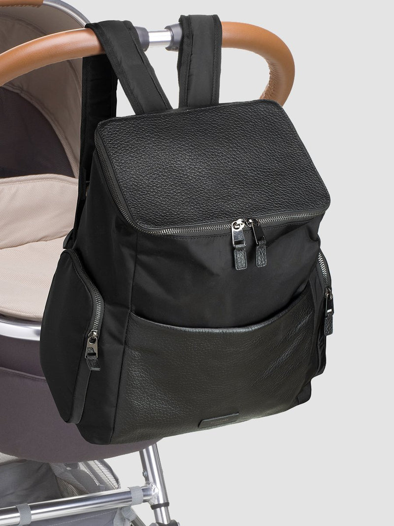 Storksak Alyssa | convertible Changing bag Backpack | Leather Baby Bag | Black diaper Bag with built-in buggy attachment