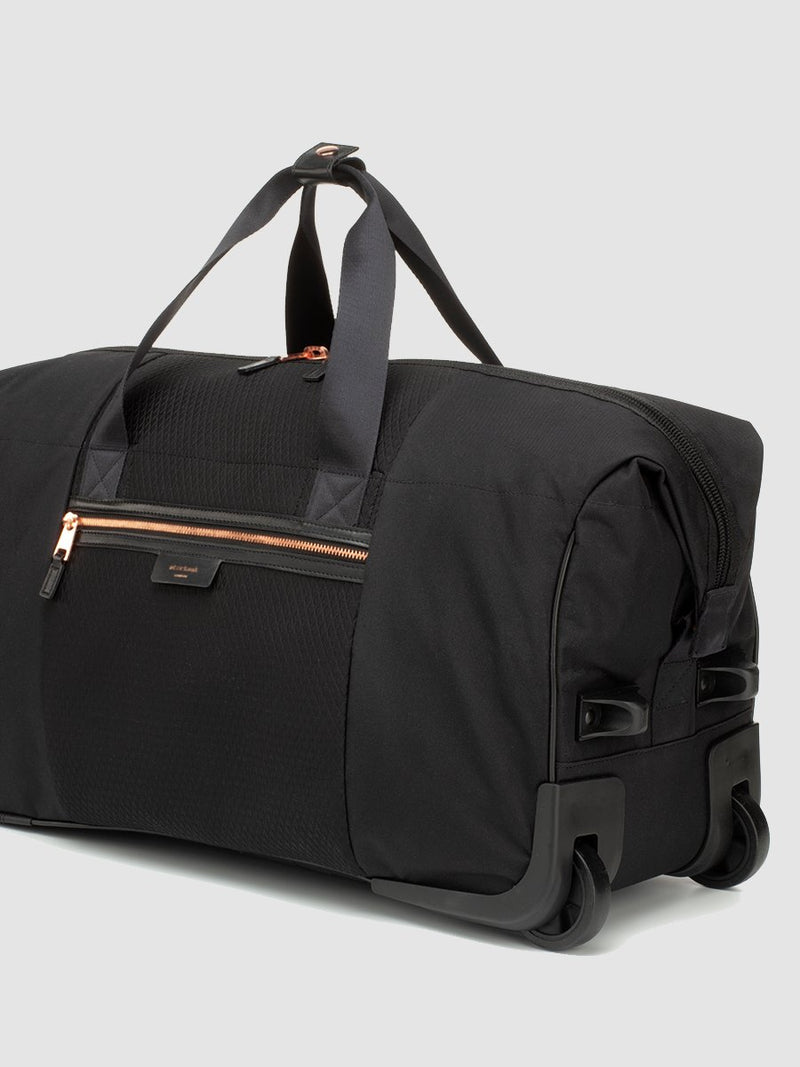 storksak cabin carry-on scuba black | hospital bag with rose gold trims | weekend bag with wheels
