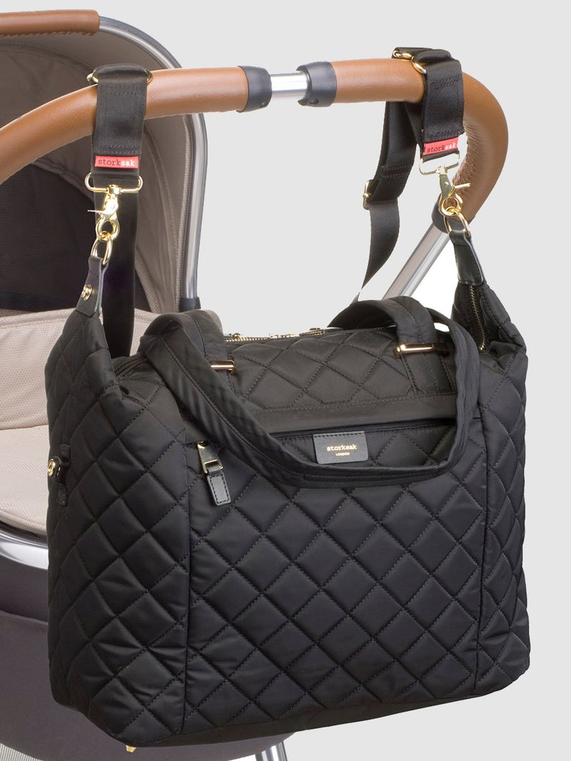 storksak stevie quilt black, changing bag, attached to pram with stroller straps