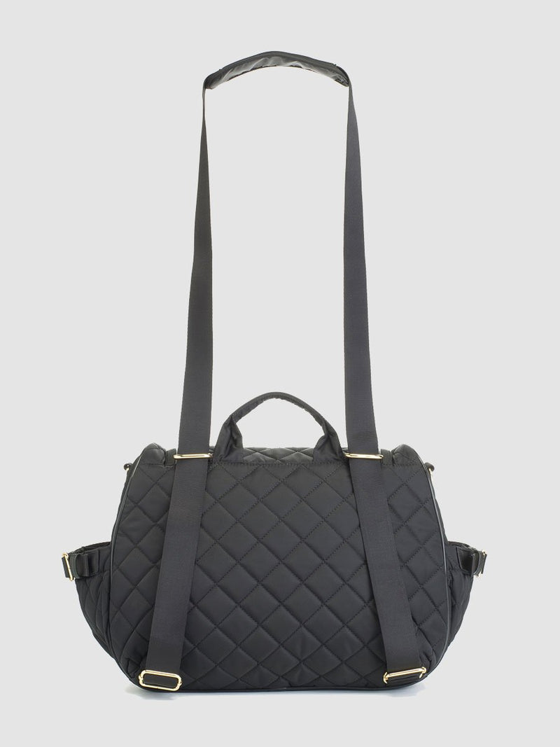 storksak poppy quilt black, convertible changing bag, back view with straps as shoulder bag
