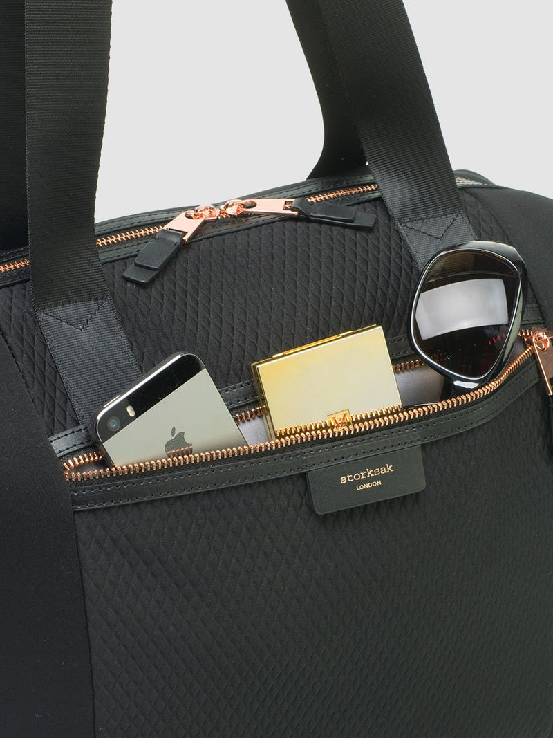 storksak stevie luxe scuba black, changing bag, close up of front pocket with rose gold hardware