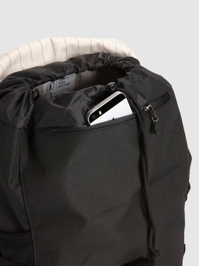 storksak travel eco backpack black, changing bag rucksack, recycled material, zipped pocket under flap