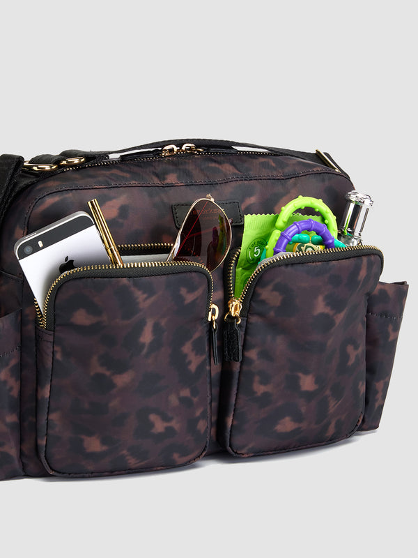 storksak stroller bag leopard | baby and mum items in pockets